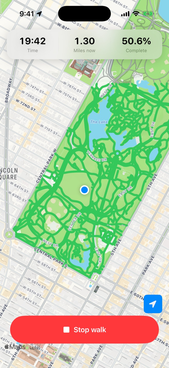 Park Tracker mid-walk: a live stats bar reading 19:42, 1.30 miles now, 50.6% complete, the user's blue location dot on a map where the walked paths are drawn in green, and a red Stop walk button.